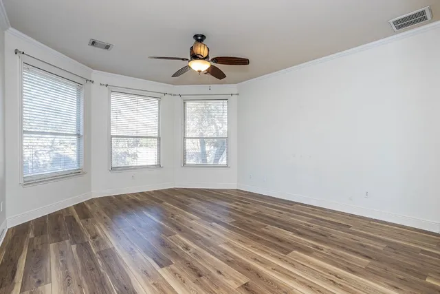 a spacious bathroom with a double vanity sink a mirror and a bathtub