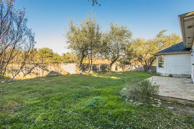 a view of house with yard