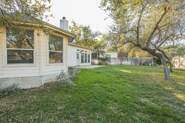 a view of a park with large trees