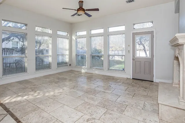 a view of an empty room with glass door