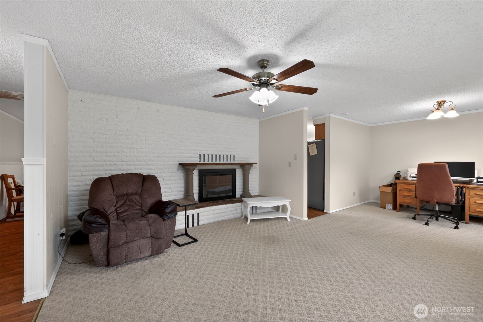 271 Hawkins Road Winlock, WA 98596 - Photo 11 of 26 a living room with furniture and a fireplace