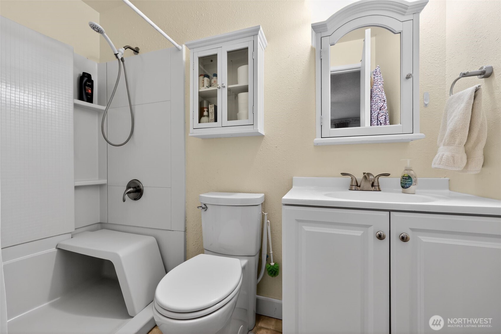 271 Hawkins Road Winlock, WA 98596 - Photo 21 of 26 a bathroom with a toilet sink vanity and mirror