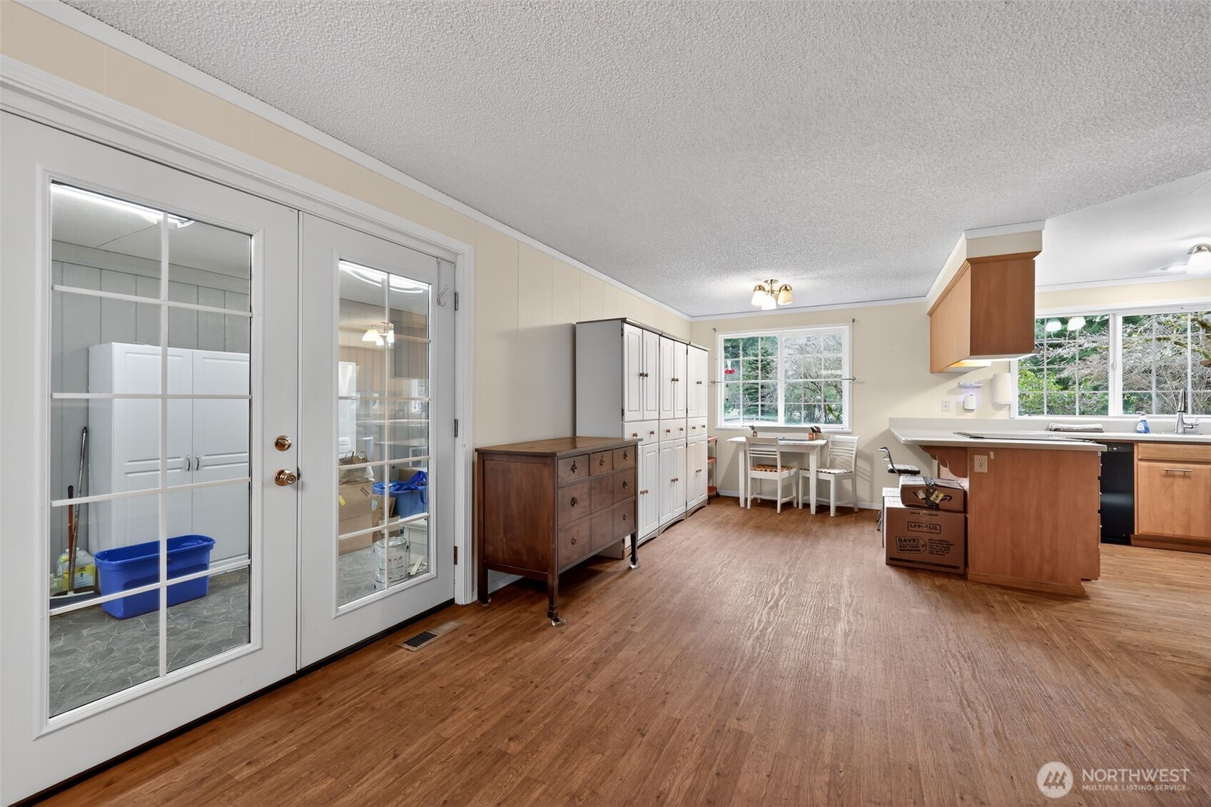 271 Hawkins Road Winlock, WA 98596 - Photo 5 of 26 a living room with furniture a flat screen tv and floor to ceiling window