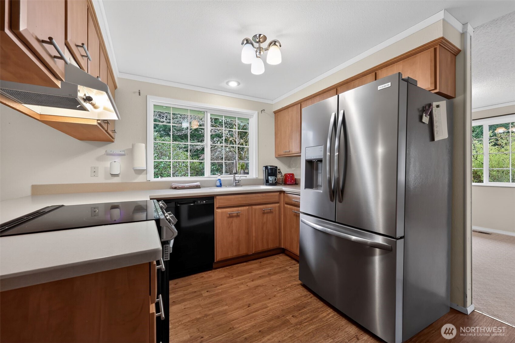 271 Hawkins Road Winlock, WA 98596 - Photo 8 of 26 a kitchen with a refrigerator a sink and cabinets