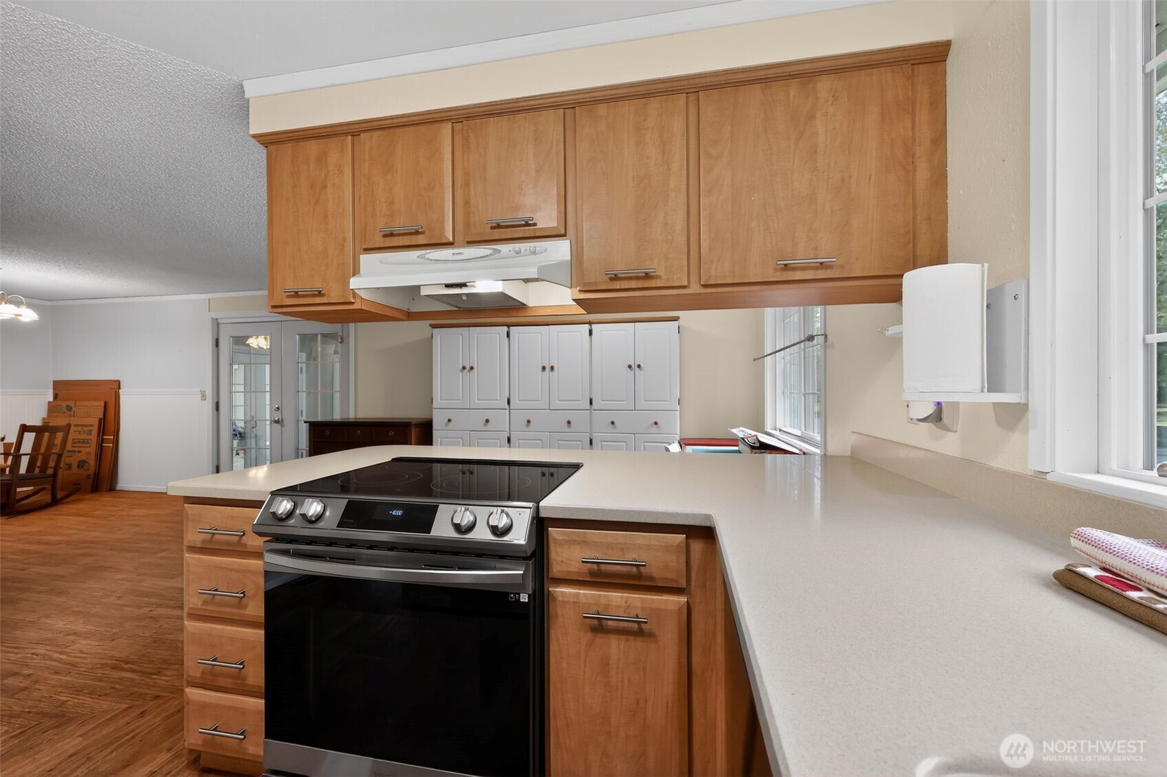 271 Hawkins Road Winlock, WA 98596 - Photo 10 of 26 a kitchen with a stove and a white cabinets