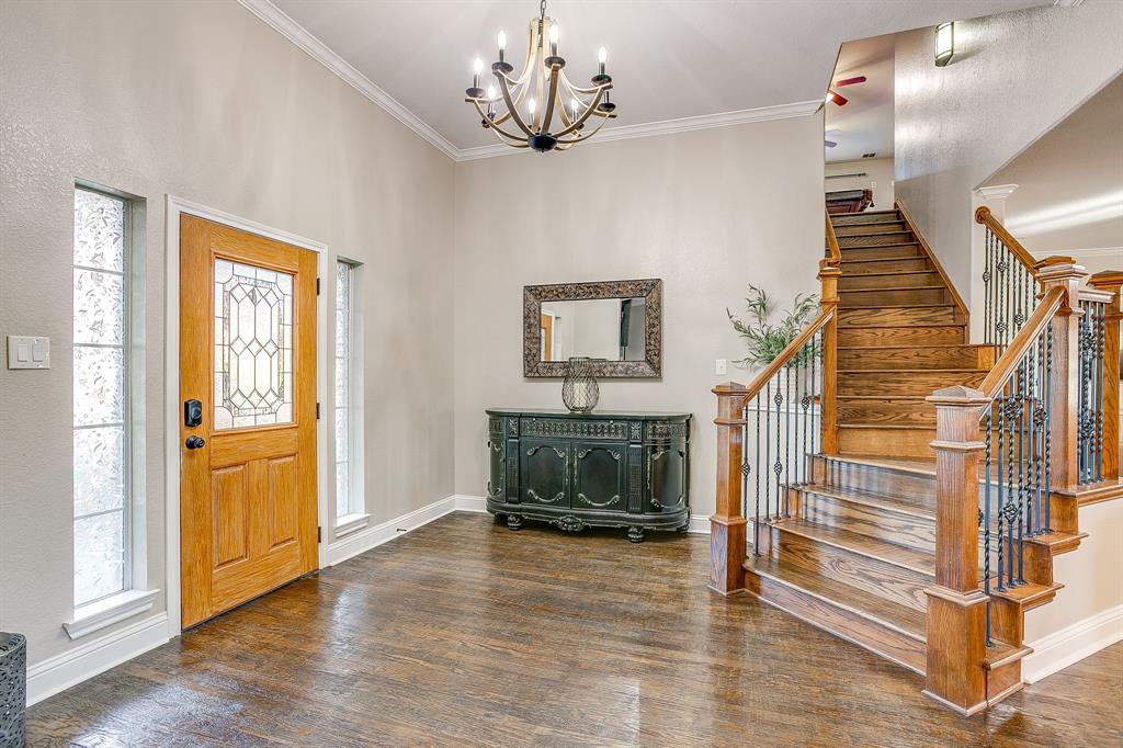 1249 Handkerchief Way Fort Worth, TX 76052 - Photo 13 of 40 a view of a livingroom with wooden floor and stairs