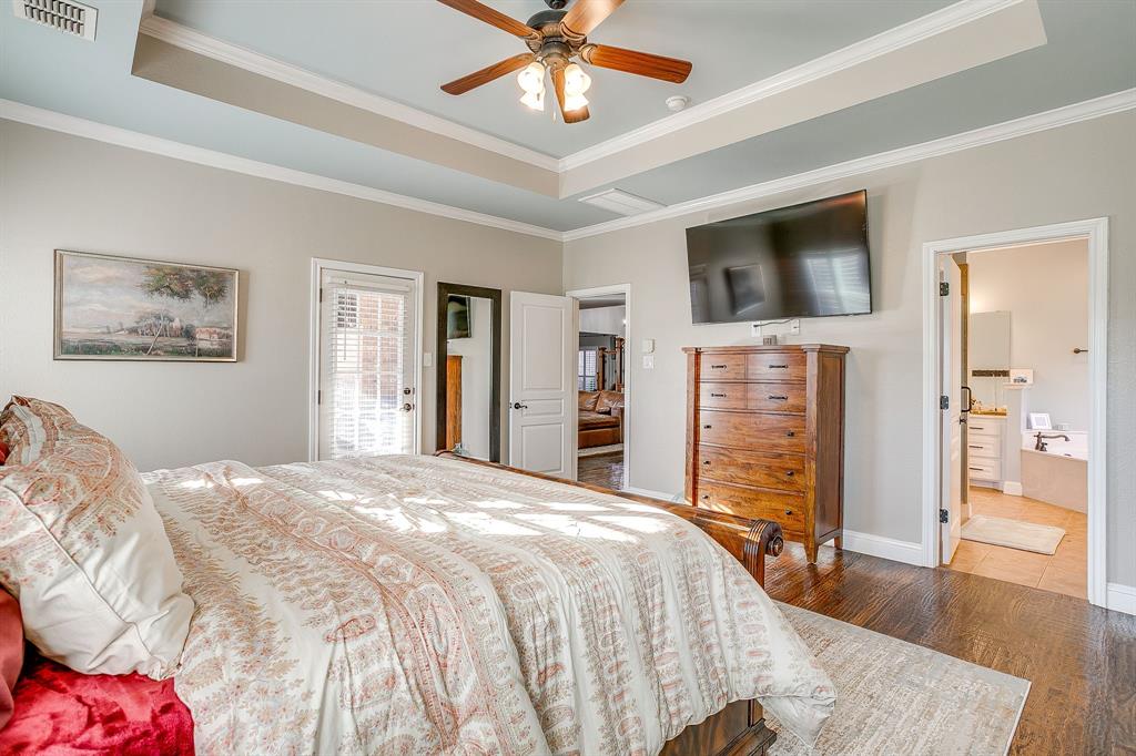 1249 Handkerchief Way Fort Worth, TX 76052 - Photo 17 of 40 a spacious bedroom with a bed and a flat screen tv
