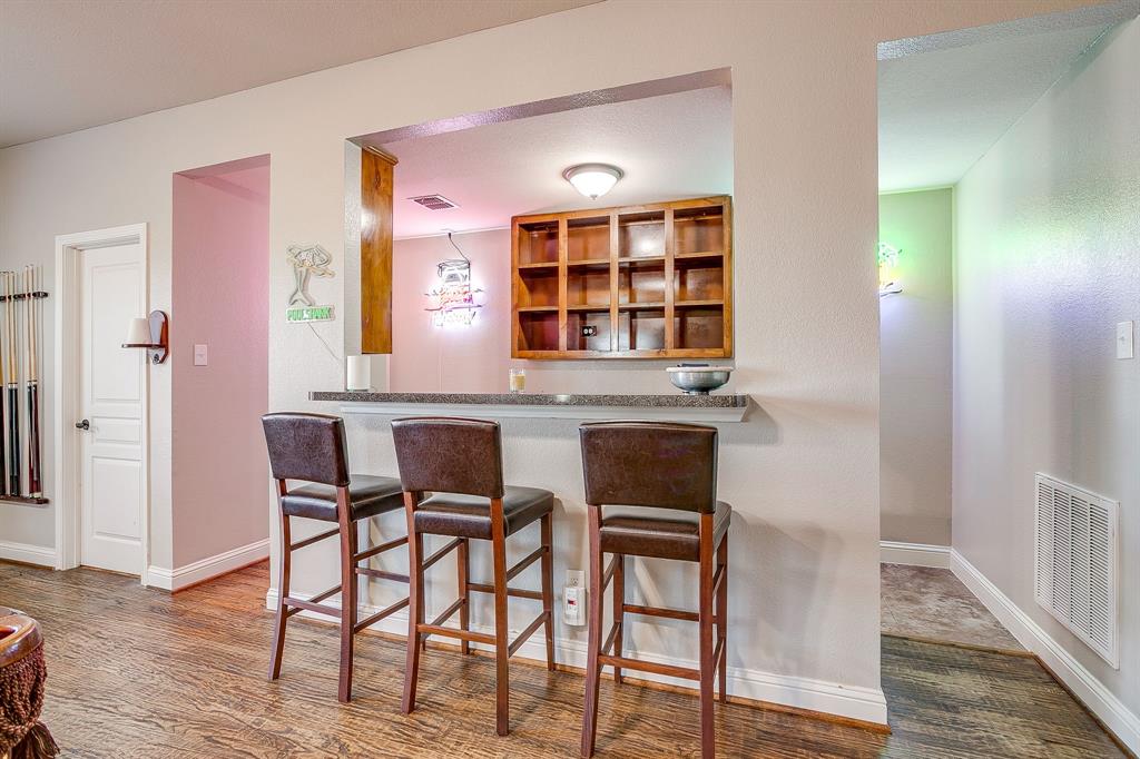 1249 Handkerchief Way Fort Worth, TX 76052 - Photo 23 of 40 a view of a dining room with furniture and wooden floor