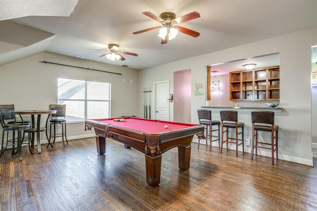 1249 Handkerchief Way Fort Worth, TX 76052 - Photo 25 of 40 a room with pool table windows and wooden floor