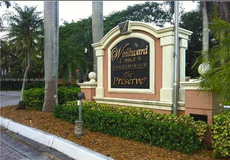 4015 West McNab Road, Unit D308 Pompano Beach, FL 33069 - Photo 13 of 17 a view of entrance gate of a house