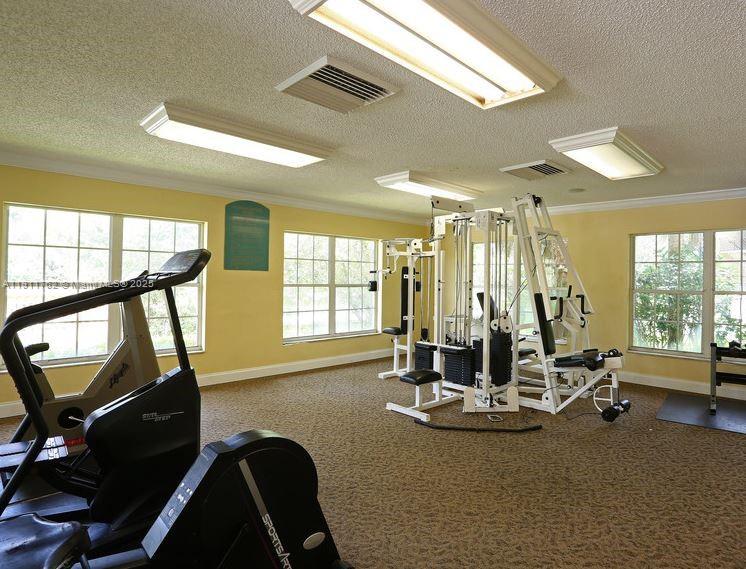 4015 West McNab Road, Unit D308 Pompano Beach, FL 33069 - Photo 17 of 17 a view of a room with gym equipment