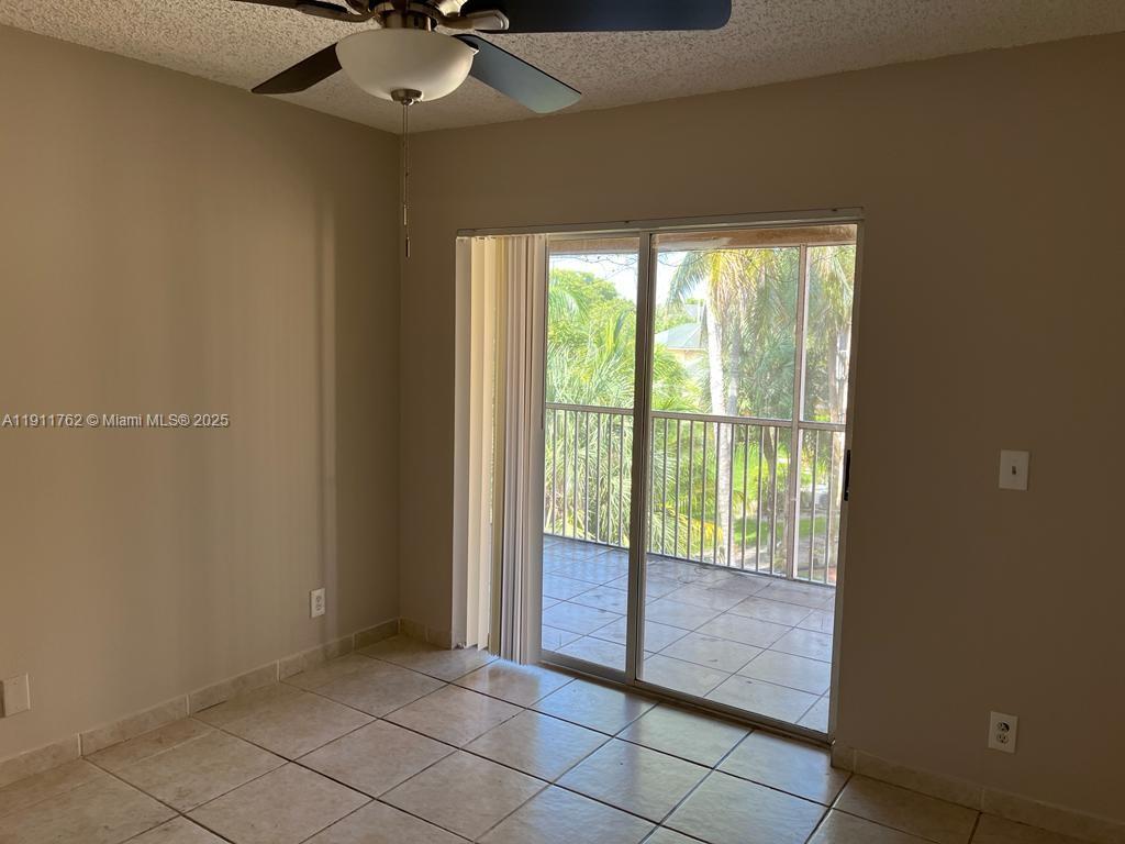4015 West McNab Road, Unit D308 Pompano Beach, FL 33069 - Photo 3 of 17 a view of an empty room and window