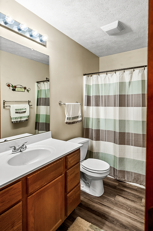 2009 Marina Drive Normal, IL 61761 - Photo 11 of 15 a bathroom with a sink a toilet and a mirror