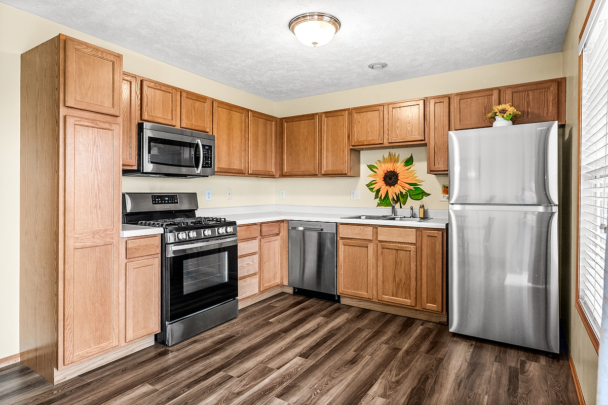 2009 Marina Drive Normal, IL 61761 - Photo 6 of 15 a kitchen with a refrigerator a stove top oven a sink and cabinets