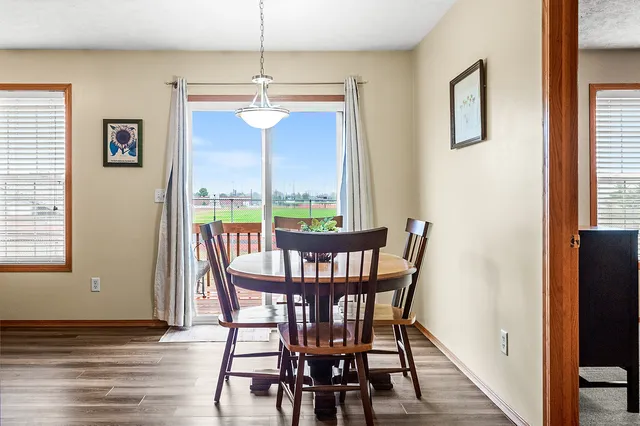a view of a dining room with furniture window and wooden floor