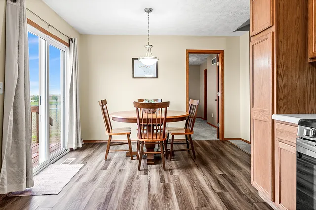 a view of a dining room with furniture window and wooden floor