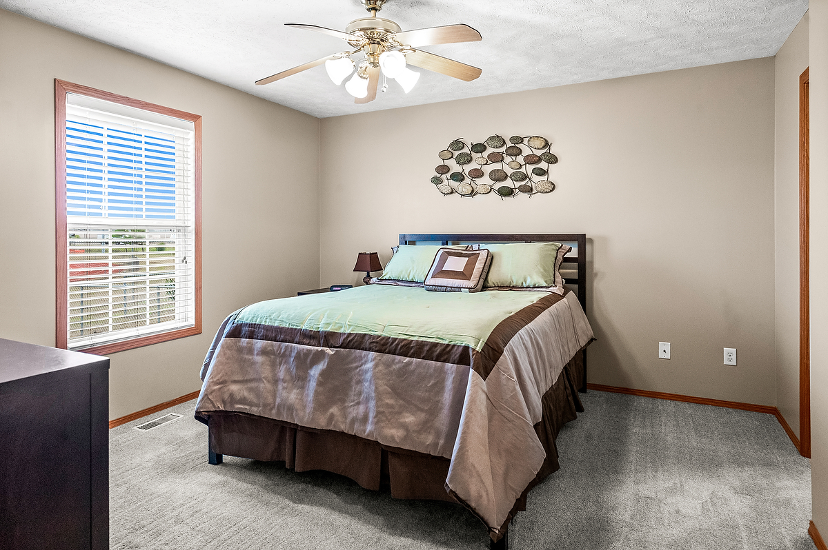 2009 Marina Drive Normal, IL 61761 - Photo 9 of 15 a bedroom with a bed and a chandelier