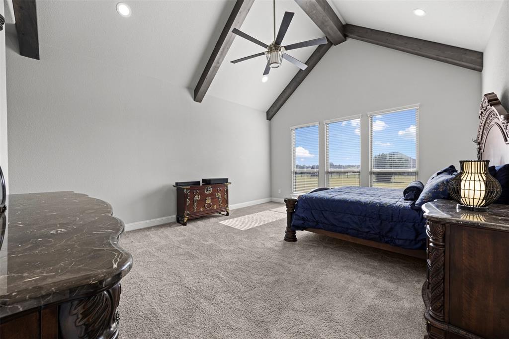 6381 Rigel Road Godley, TX 76044 - Photo 26 of 40 a bedroom with a bed and a television