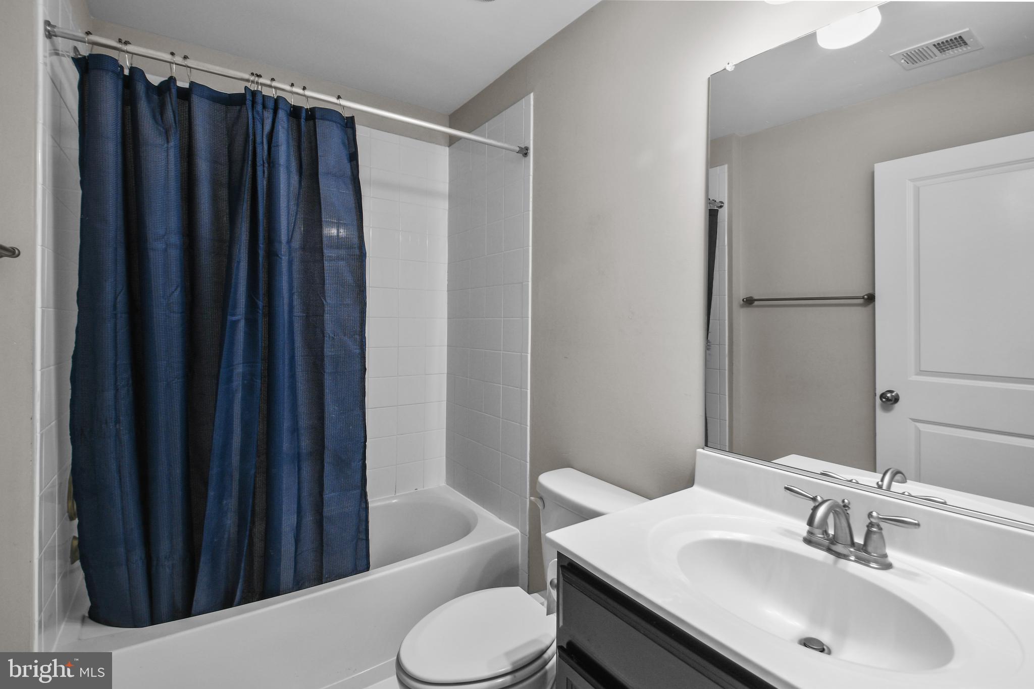 4648 Cambria Road Frederick, MD 21703 - Photo 20 of 22 a bathroom with a sink vanity mirror and toilet
