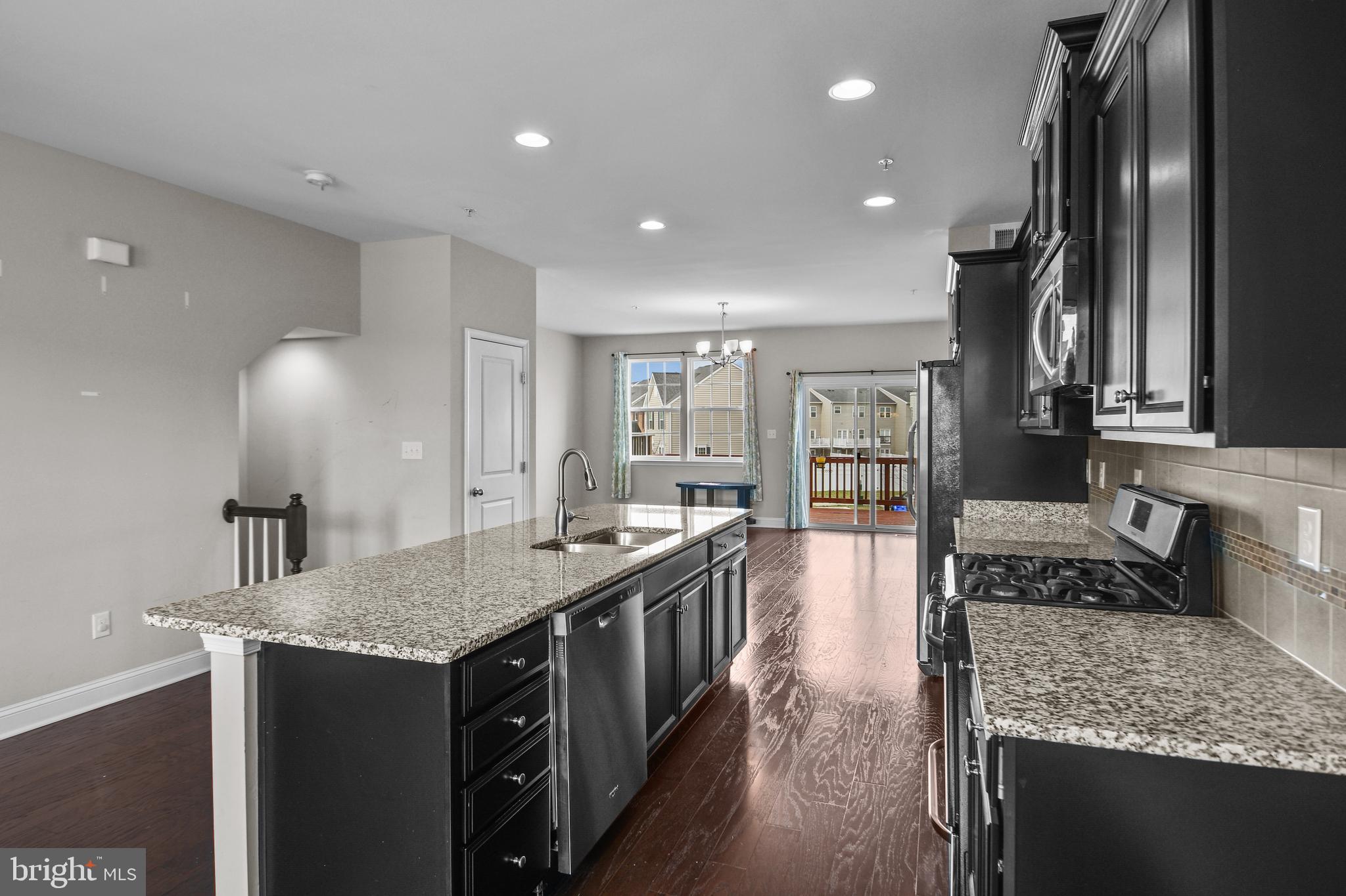 4648 Cambria Road Frederick, MD 21703 - Photo 3 of 22 a kitchen with stainless steel appliances granite countertop a sink stove and refrigerator