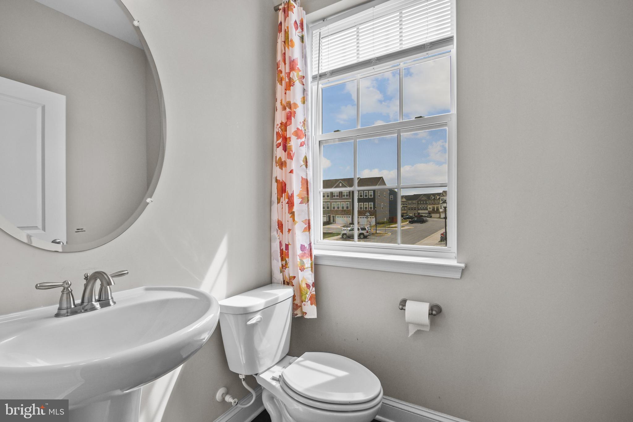 4648 Cambria Road Frederick, MD 21703 - Photo 7 of 22 a bathroom with a sink and a mirror