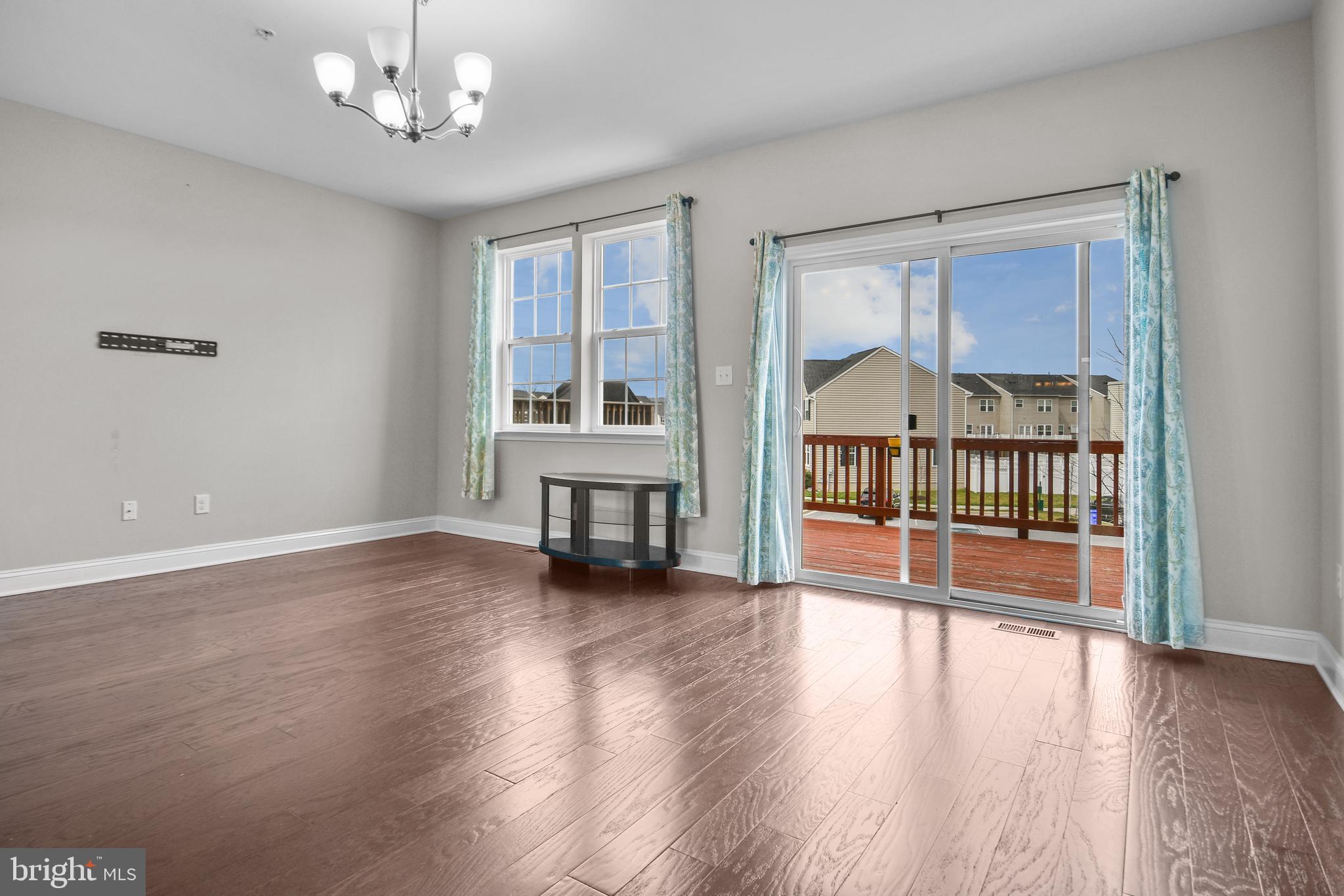 4648 Cambria Road Frederick, MD 21703 - Photo 8 of 22 wooden floor in an empty room with a window
