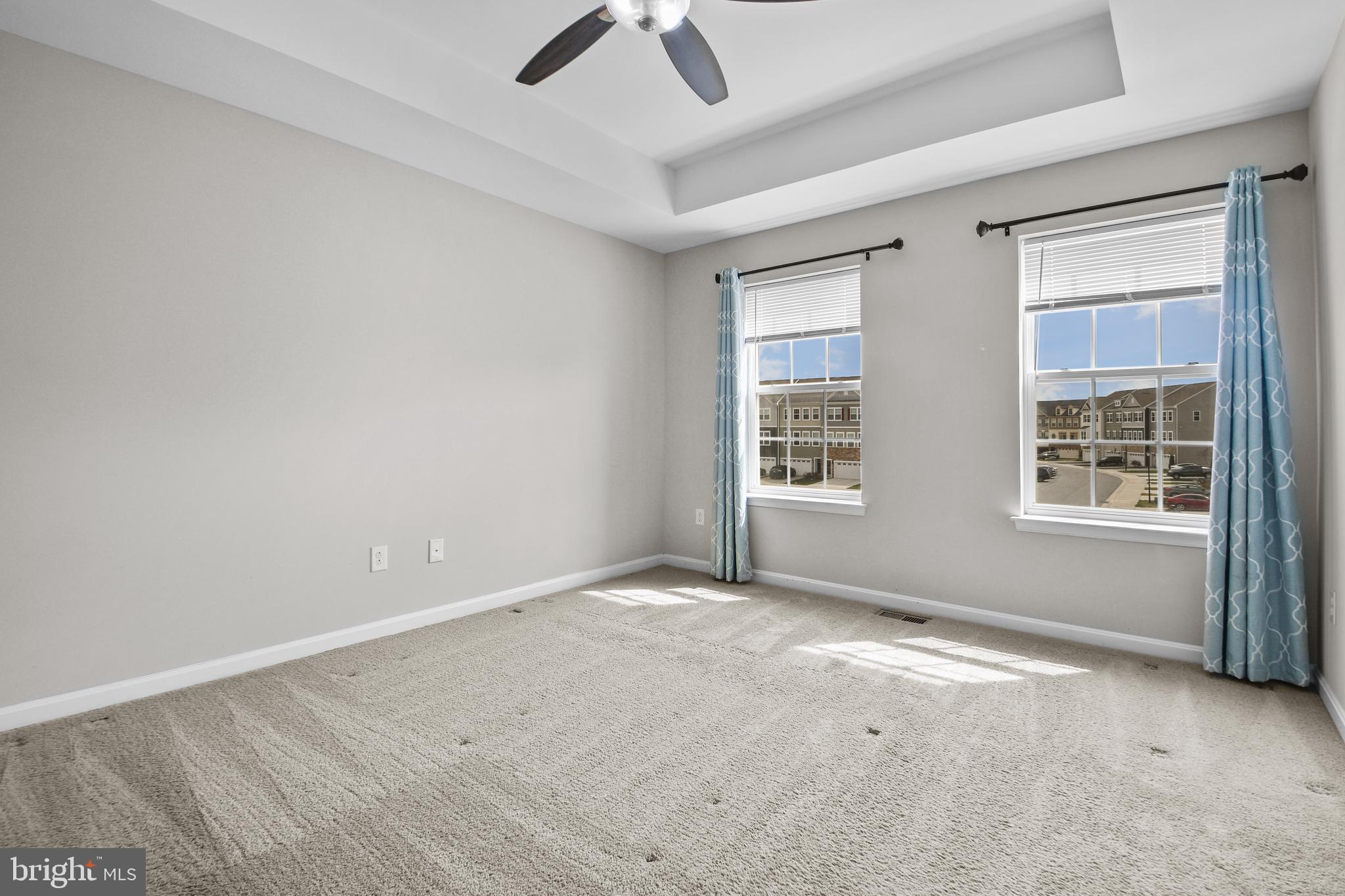 4648 Cambria Road Frederick, MD 21703 - Photo 10 of 22 an empty room with windows and ceiling fan