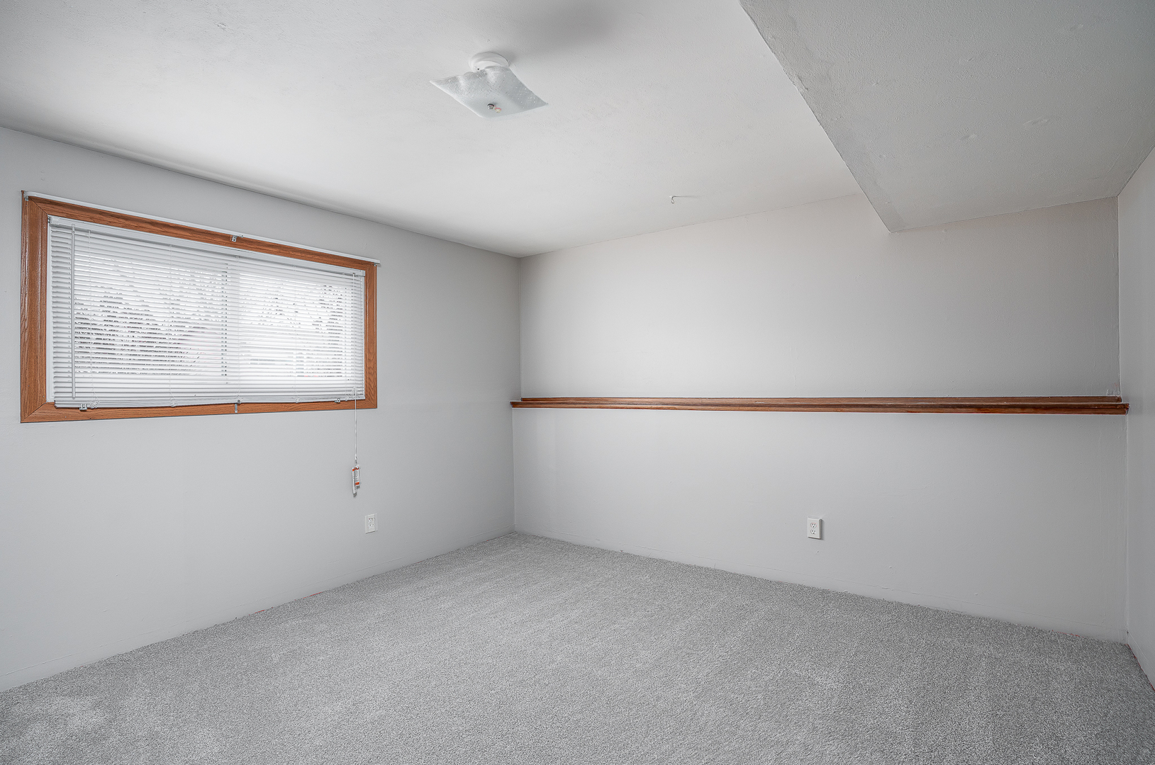 4905 50th Street Moline, IL 61265 - Photo 20 of 25 a view of an empty room with a window