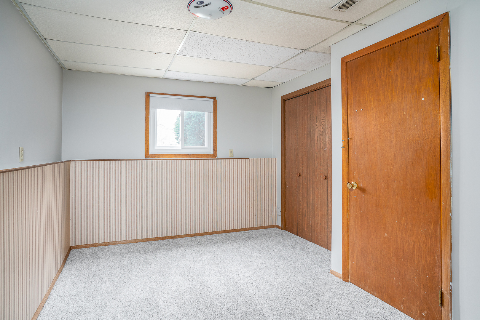 4905 50th Street Moline, IL 61265 - Photo 22 of 25 a view of an empty room with a window