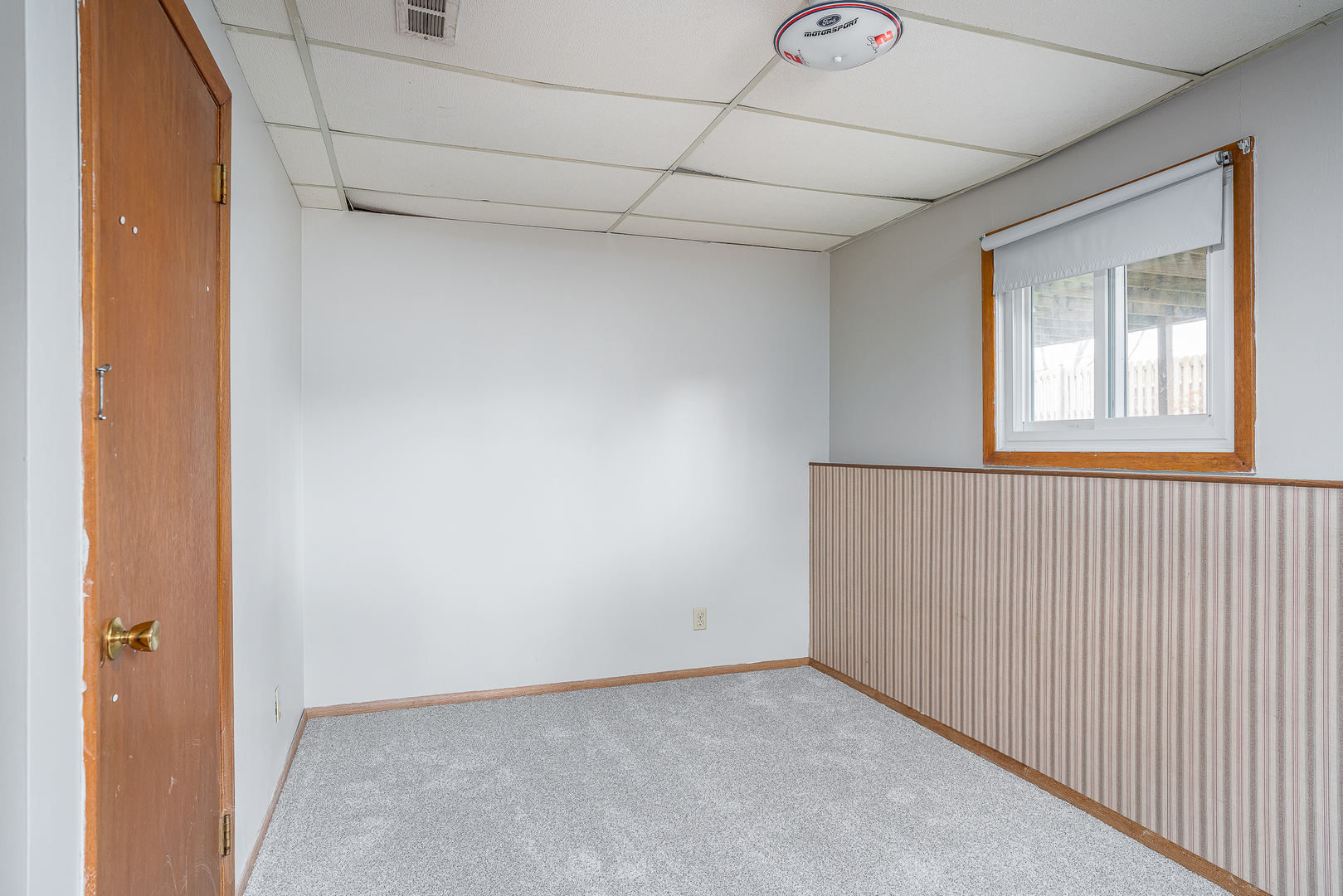 4905 50th Street Moline, IL 61265 - Photo 23 of 25 a view of an empty room with a window