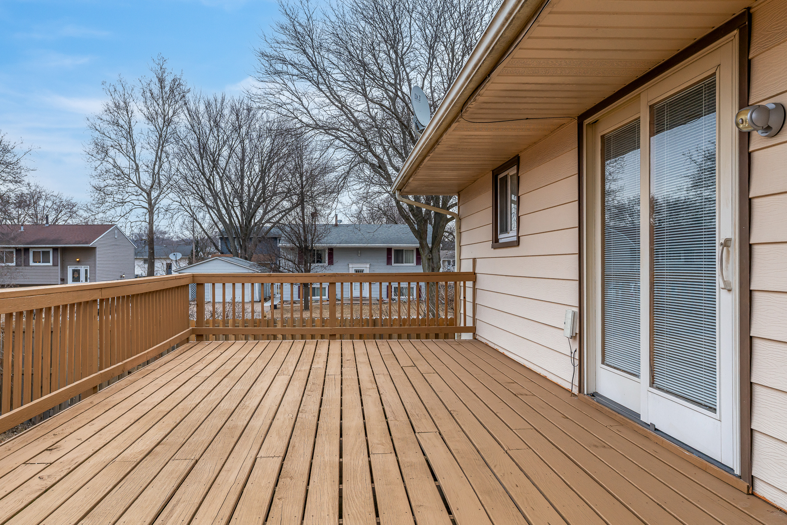 4905 50th Street Moline, IL 61265 - Photo 6 of 25 a view of deck with wooden floor and fence next to a yard