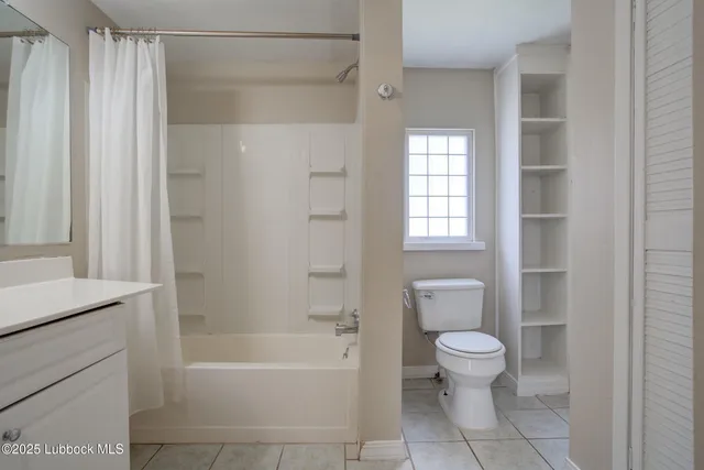 a bathroom with a bathtub toilet and sink