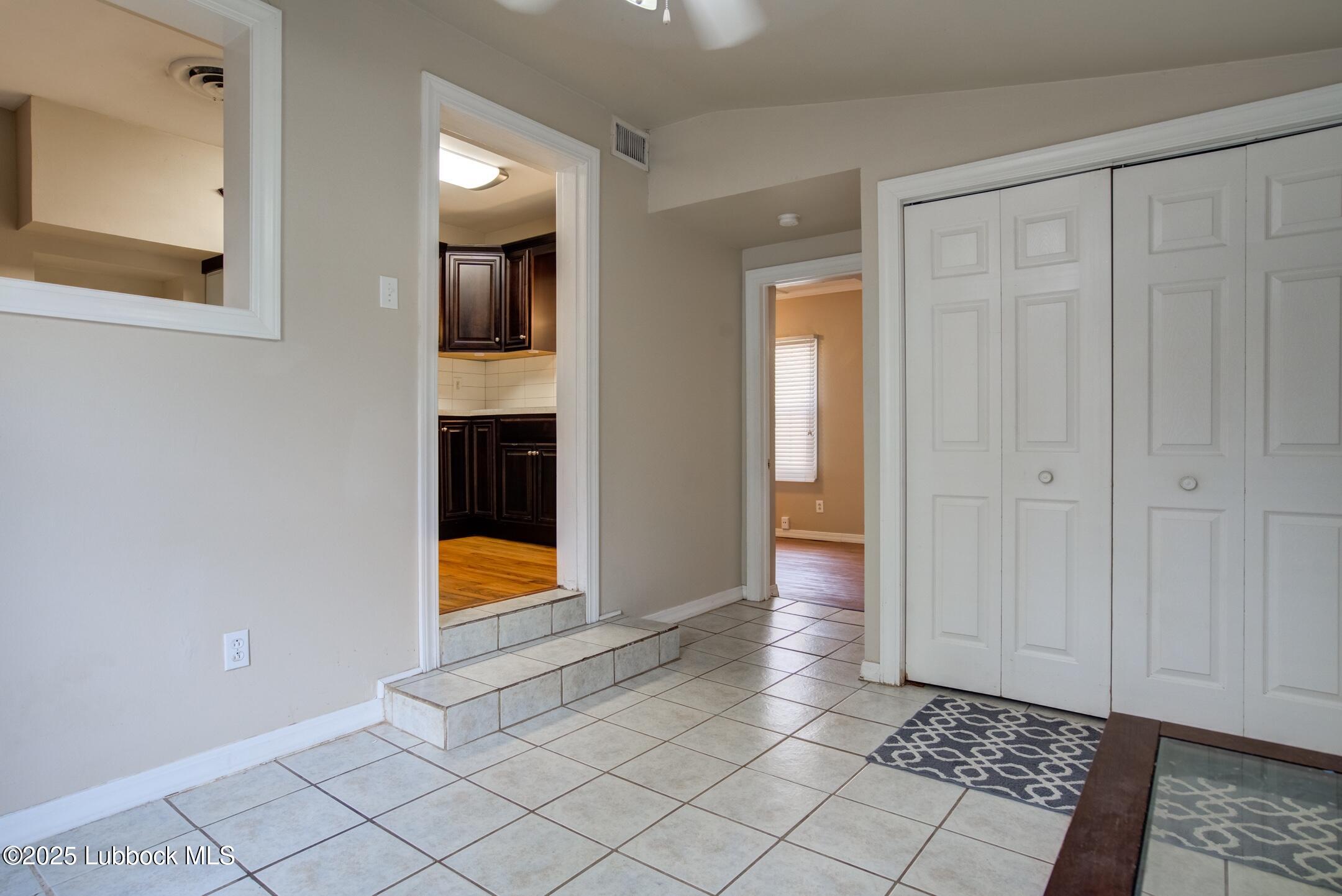 2308 28th Street Lubbock, TX 79411 - Photo 7 of 21 a view of an entryway and wooden floor