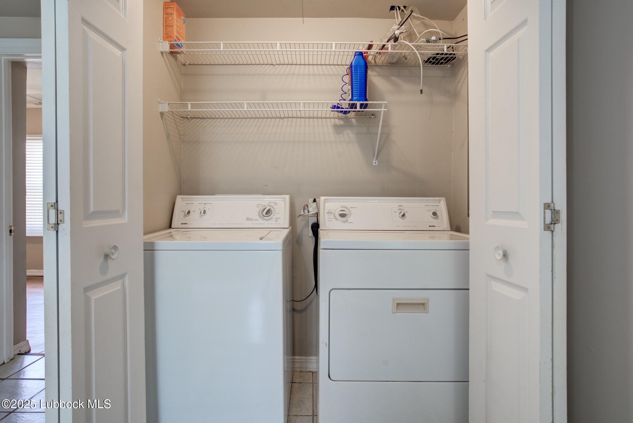 2308 28th Street Lubbock, TX 79411 - Photo 8 of 21 a utility room with dryer and washer