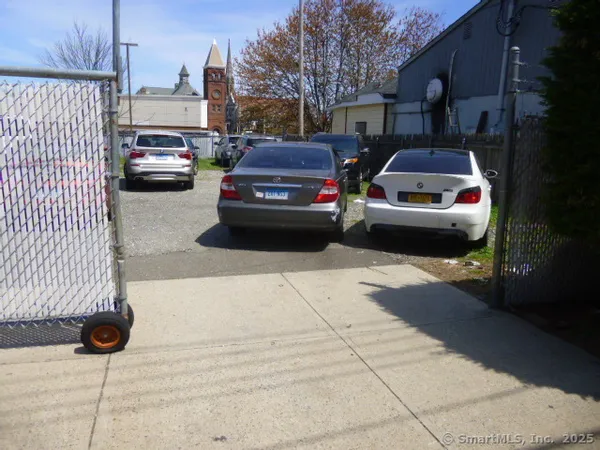 a view of street with parked cars