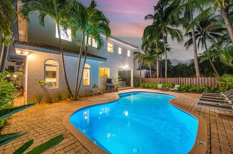 a view of swimming pool with outdoor seating