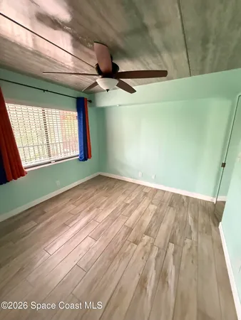 a view of empty room with windows