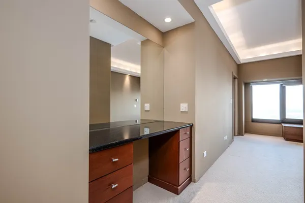 a bathroom with a granite countertop sink mirror and double
