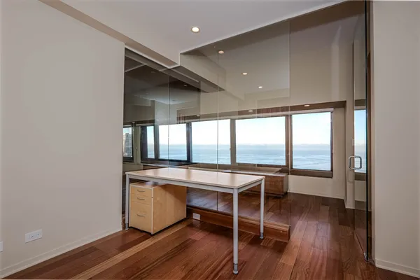 a room with wooden floor and furniture