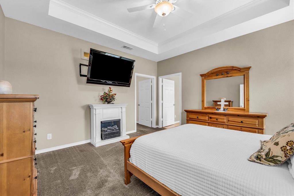 613 Bone Road Valley Mills, TX 76689 - Photo 14 of 40 a bedroom with a bed and a flat screen tv