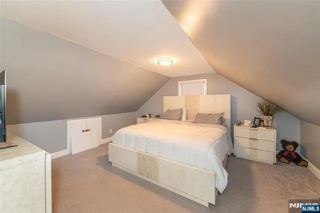 a spacious bedroom with a bed and a couch