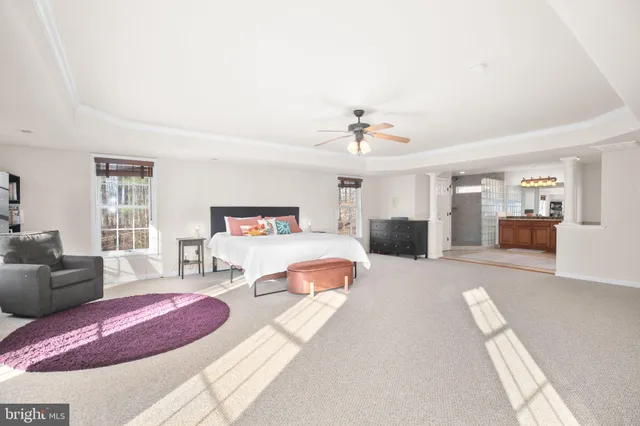 a view of a balcony with wooden fence and trees