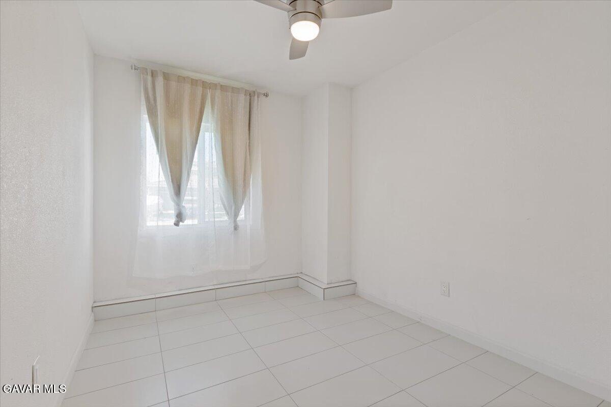 4706 Spice Street, Unit 2 Lancaster, CA 93536 - Photo 13 of 14 an empty room with windows