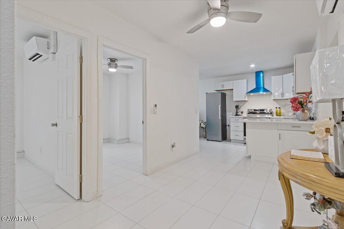 4706 Spice Street, Unit 2 Lancaster, CA 93536 - Photo 4 of 14 a view of a kitchen with a sink dishwasher and a refrigerator