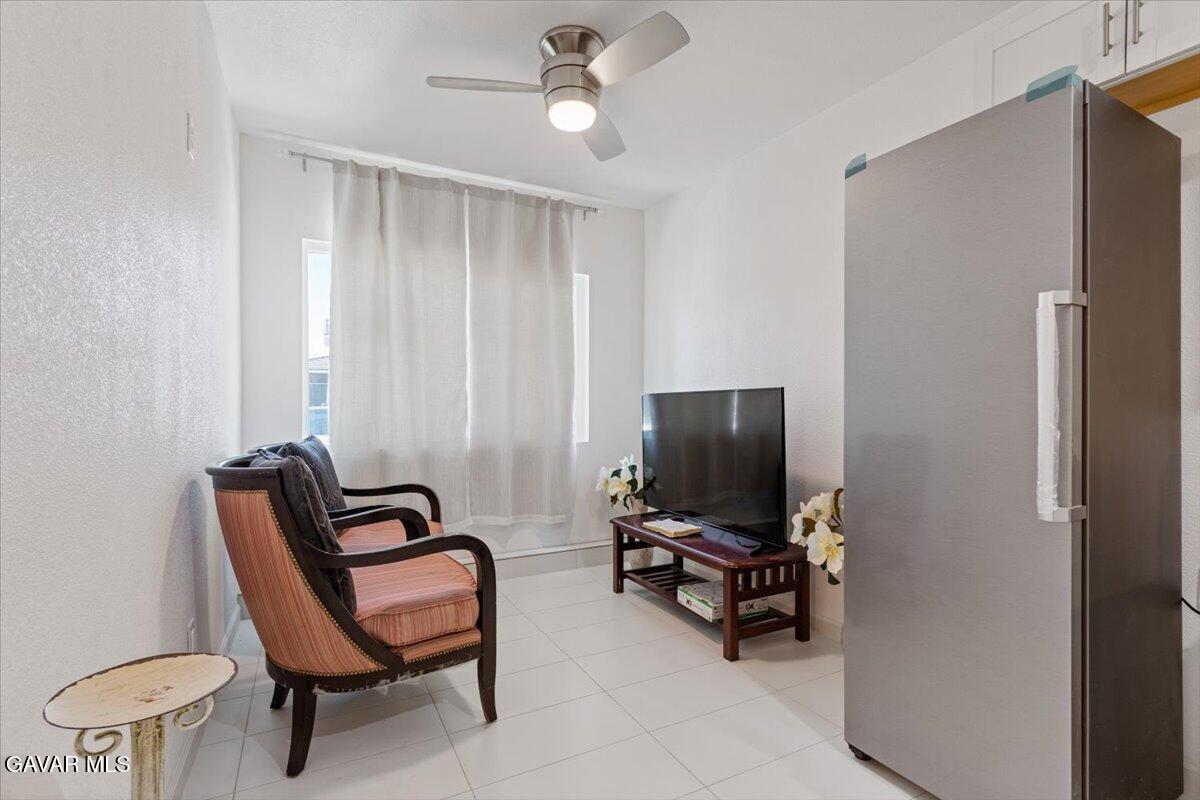 4706 Spice Street, Unit 2 Lancaster, CA 93536 - Photo 7 of 14 a view of a workspace with furniture and a window