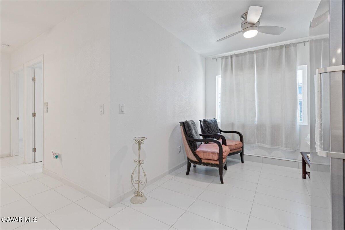 4706 Spice Street, Unit 2 Lancaster, CA 93536 - Photo 9 of 14 a living room with furniture and a window
