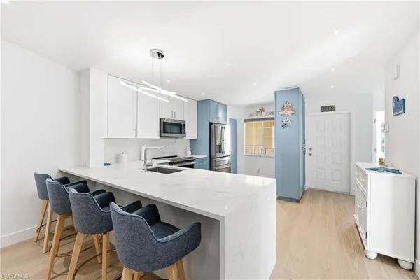 a kitchen with a sink and cabinets