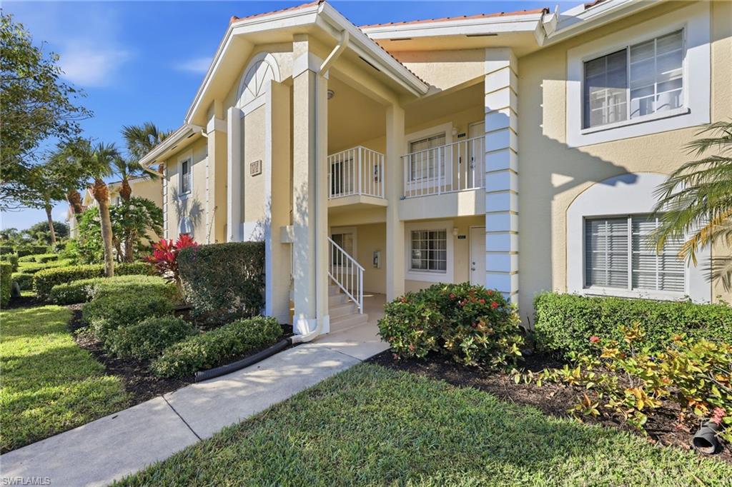 7707 Jewel Lane, Unit 201 Naples, FL 34109 - Photo 2 of 31 View of property with stairway