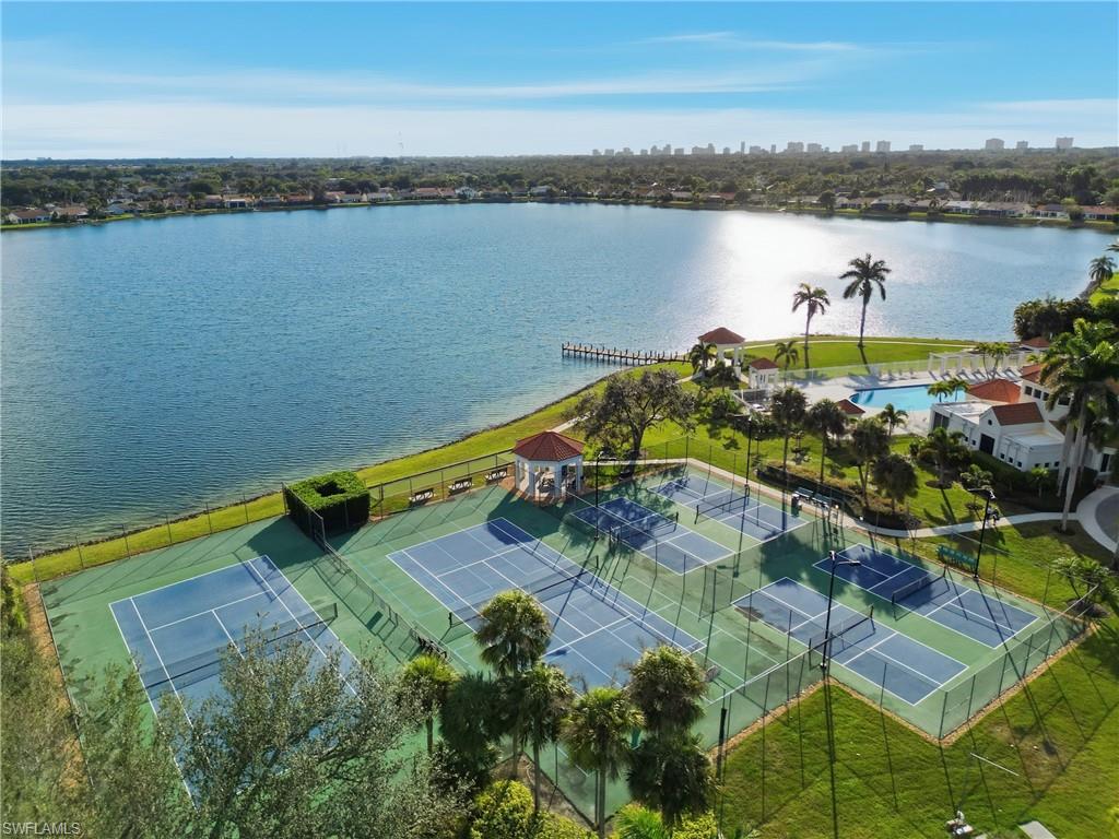 7707 Jewel Lane, Unit 201 Naples, FL 34109 - Photo 29 of 31 Aerial view of a large body of water and city skyline