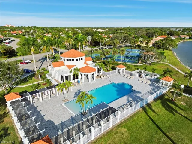 aerial view of a house with a lake view